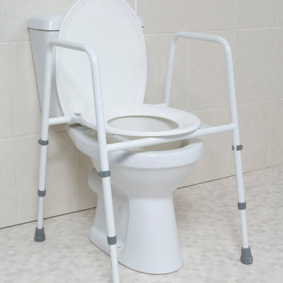 the image shows the height adjustable toilet frame with seat on a toilet