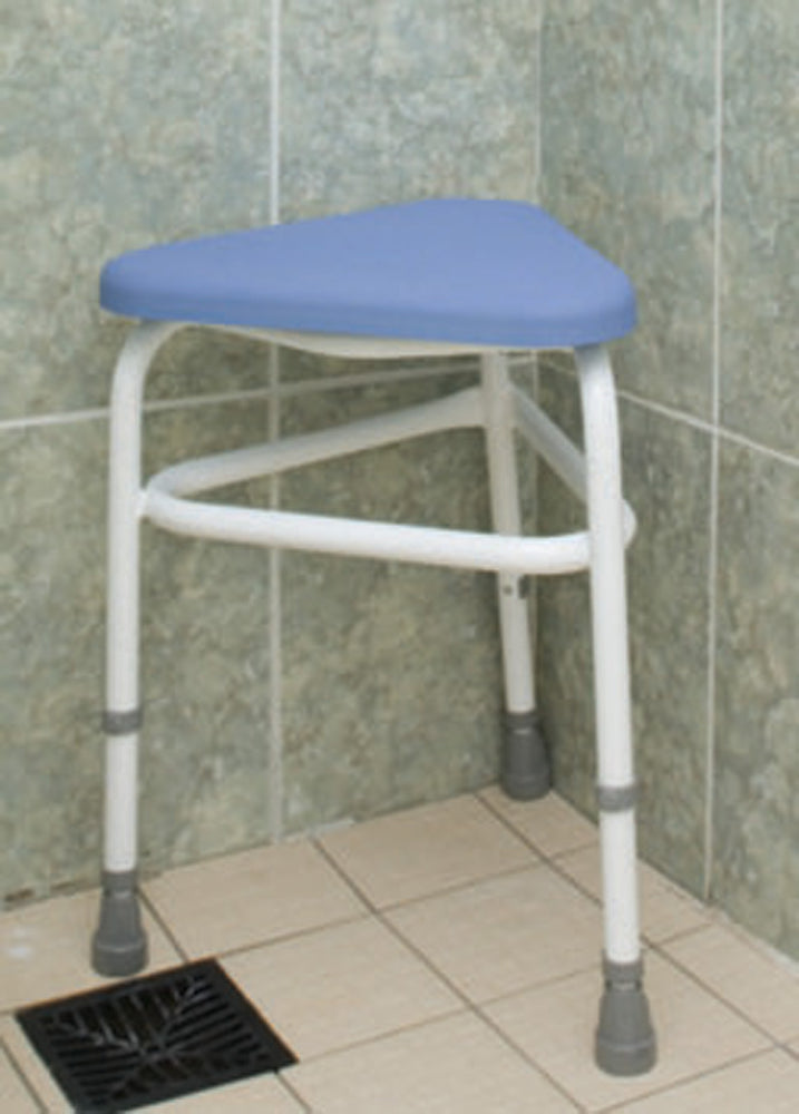 shows the padded corner stool in a wetroom
