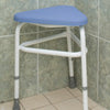 shows the padded corner stool in a wetroom