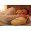 the image shows a woman lying down with her head resting on the lifemax memory bead bolster pillow