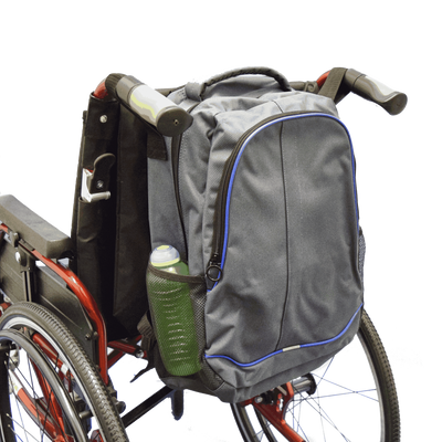 shows the Mobility Rucksack with Pockets attached to the back of a wheelchair.