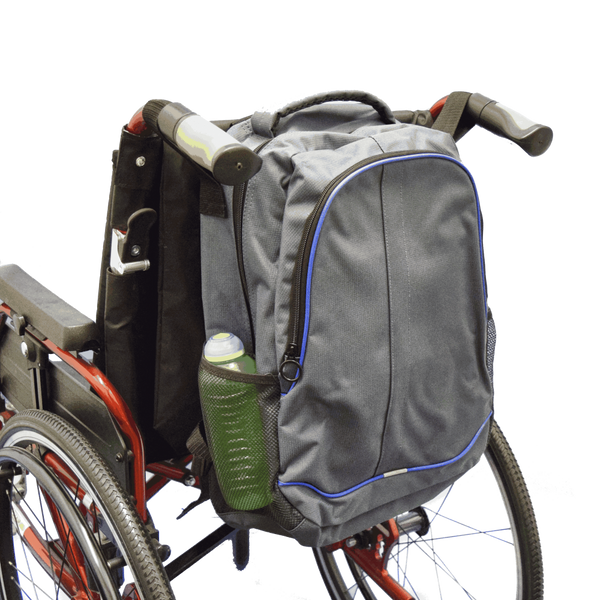 shows the Mobility Rucksack with Pockets attached to the back of a wheelchair.