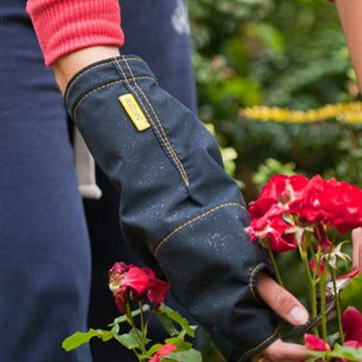 shows a woman gardening wearing a blue outdoor cast protector