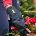 shows a woman gardening wearing a blue outdoor cast protector