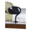 the stander bed cane on a bed with a tv remote in the pocket bag
