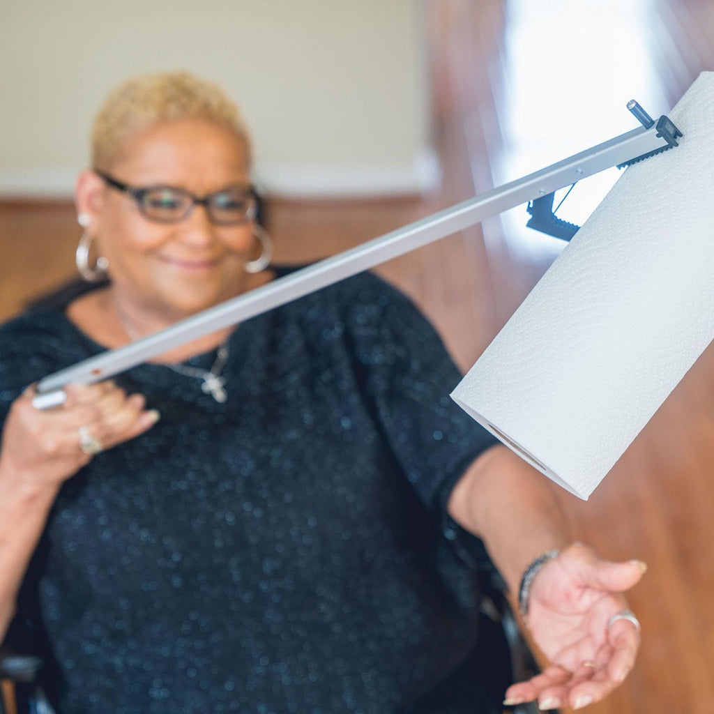 Lightweight Reacher Grabber being used to grab a piece of paper