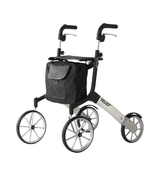 shows the lets go out rollator in black and silver with the bag attached