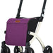 shows one more pictue of a white framed rollz flex rollator with a purple shopping bag