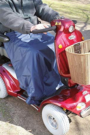 A person in a mobility scooter using a scooter leg cape