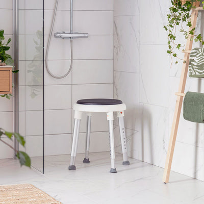 Easy shower stool with swivel pad in a bathoom