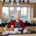 a woman using the talking kitchen scales in her kitchen