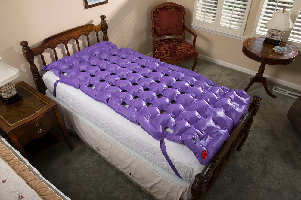 the image shows an ehob mattress single overlay with pump on a bed