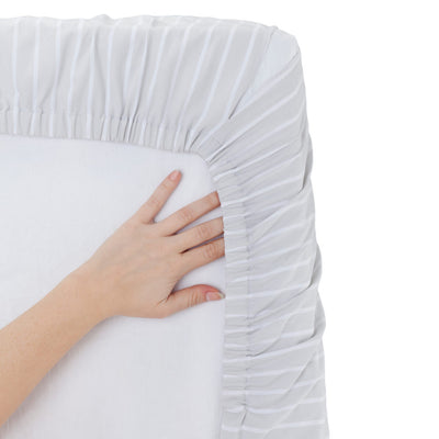 the image shows how the wendylett base slide sheet fits to a mattress like a standard bedsheet