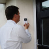 the image shows a caller using the lifemax wireless video door phone